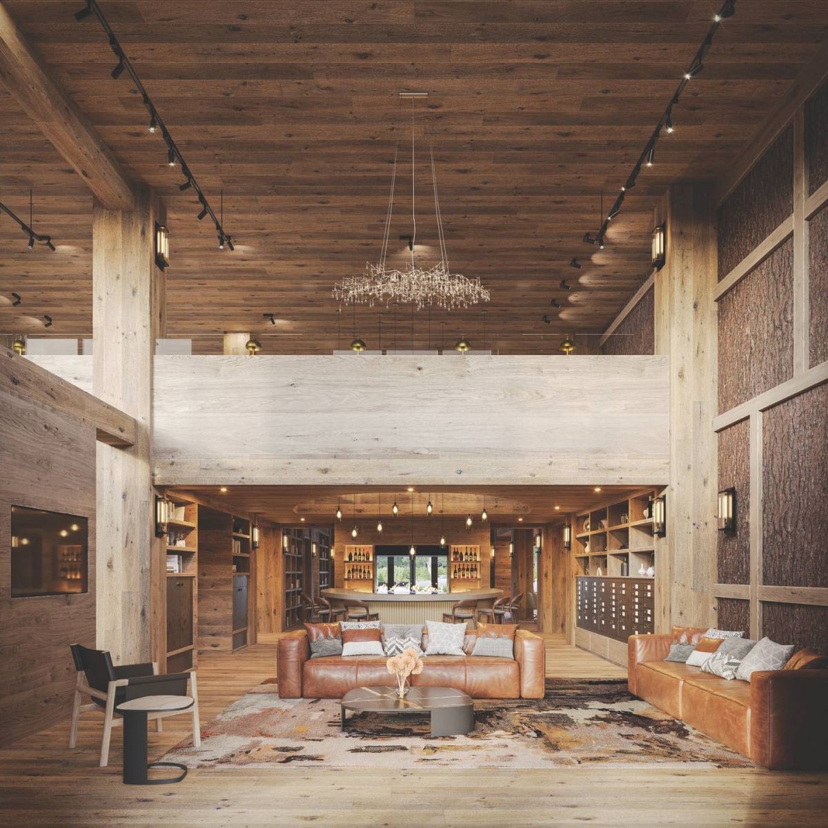 Landhaus at Gruen Spacious modern living room with wooden walls, leather sofas, bookshelves, and a chandelier.